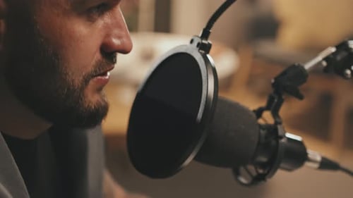 Close Up of Bearded Man Talking on Podcast