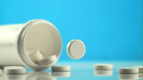 One Tablet Falls on the Table and Rotates