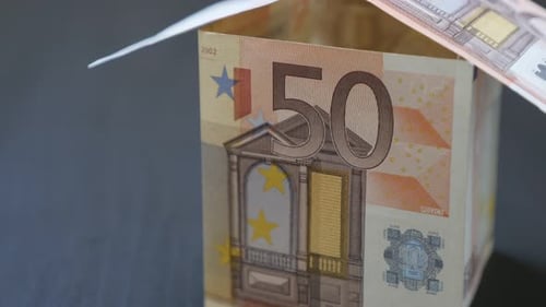 Improvised shape of house made of Euro paper money of 50 value bills close-up 4K 2160p 30fps UltraHD