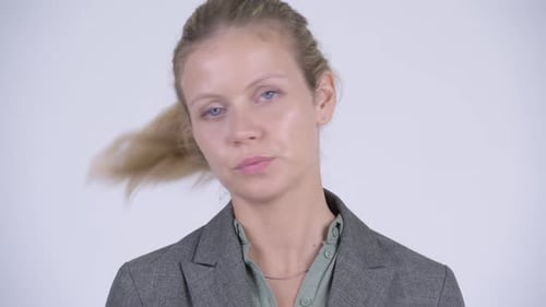 Face of Young Blonde Businesswoman Nodding Head No
