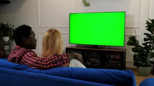 Green Screen TV Multiethnic Family Couple Embrace Watching Movie Series on TV