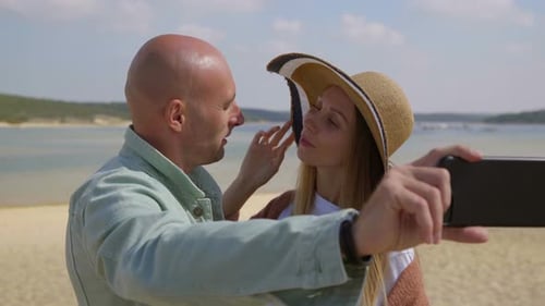 Couple Taking Selfie with Smartphone on Beach