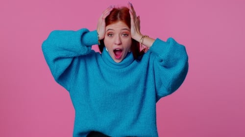 Woman Expressing Surprise on Pink Background