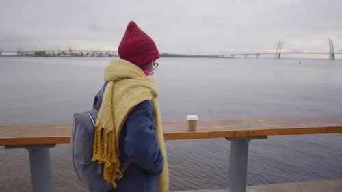 Asian Female Tourist Taking Selfie on City Riverside