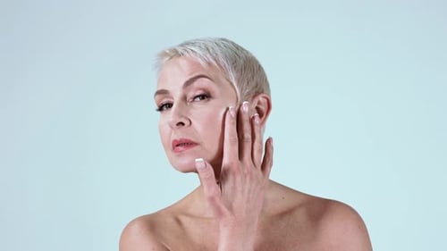 Woman Applying Moisturizer for Radiant, Healthy Skin