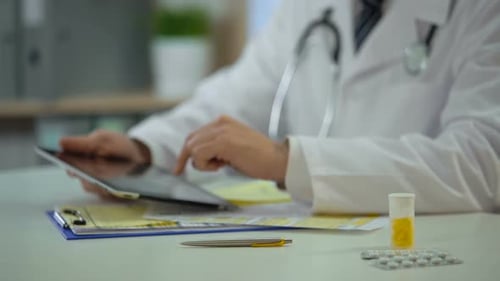 Head Physician Consulting Patient Online Using Tablet, Modern Technologies