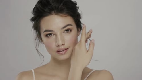 Beautiful Young Woman Posing with Elegant Updo