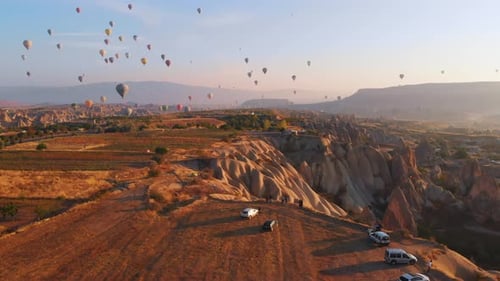 Colorful Hot Air Balloons Ascending at Cappadocia Sunrise