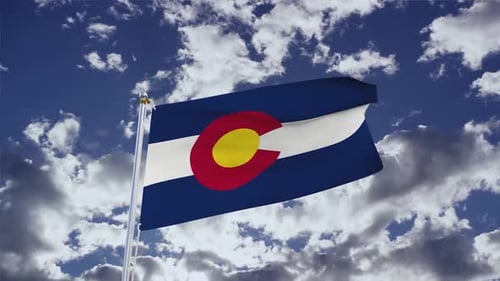 Colorado State Flag Waving in Blue Sky with Clouds