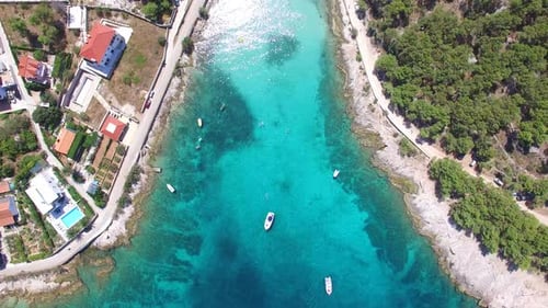 Aerial view of people swimming in turquoise bay on the island of Brac, Croatia