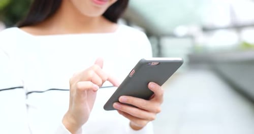 Woman Use of Cellphone at Outdoor