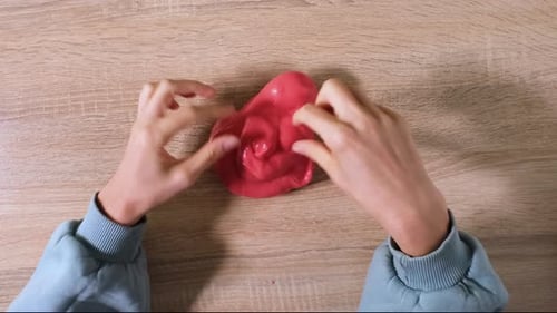 Playing with Slime Stretching the Gooey Substance for Fun and Stress Relief