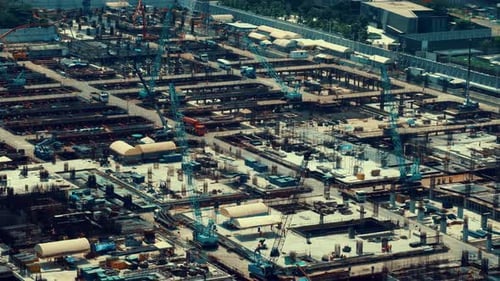 Large Construction Site with Heavy Construction Machinery in Metropolis