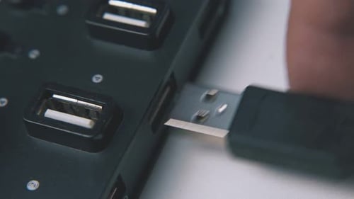 Man Connects Usb Cable to Modern Hub on White Background