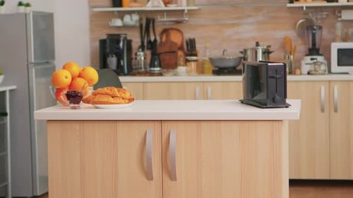 Inviting Kitchen Breakfast Scene with Fruit and Pastries