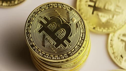 Rotating shot of Bitcoins (digital cryptocurrency) - BITCOIN