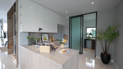 Modern Kitchen Interior with Pastries and Tablet Device