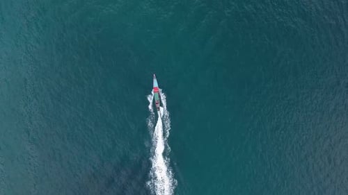 Boat Speeds Through Vast Tropical Ocean Waters