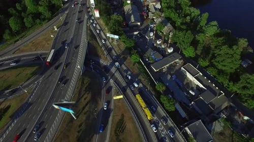 Car Driving on Highway Intersection in City. Aerial View Car Traffic on Freeway