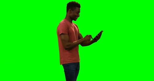 Happy man using digital tablet