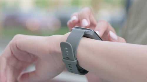 Close Up of Female Hand Using Smartwatch Outdoor