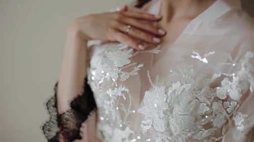 Bride Wearing White Dress with Lace Embroidery