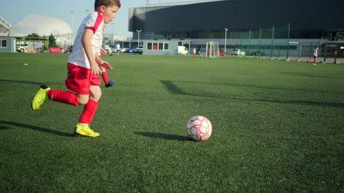 Little Soccer Player Is Scoring Goal