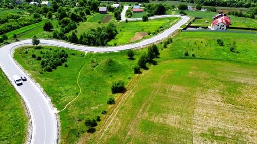 Aerial drone view of a flying over the rural agricultural landscape.
