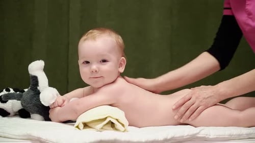 Infant Receiving Gentle Massage at Home