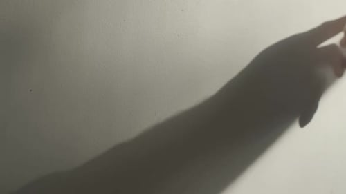 Shadow of Hand Reaching Out