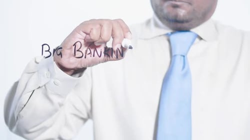 Man Writing Big Banking on Clear Surface