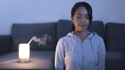 Woman having meditation at home
