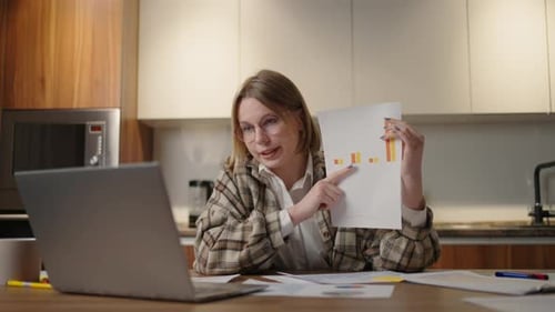 Young Woman Presents Business Data on Video Call