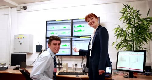 Data center colleagues talking in office