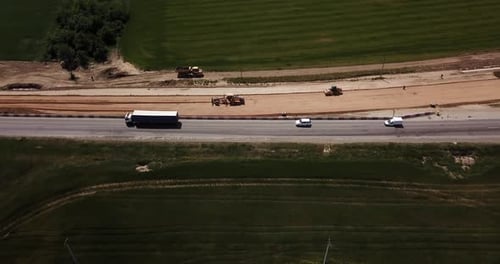 Road Construction Site with Machinery, Bulldozer, Excavation From Above. Video, Aerial View