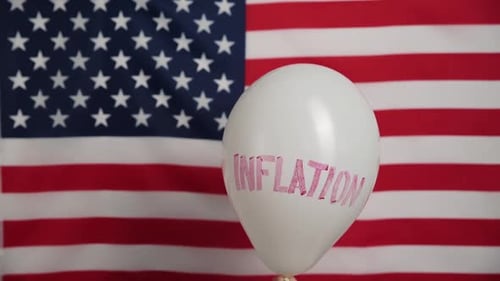 Inflation Balloon with US Flag Background