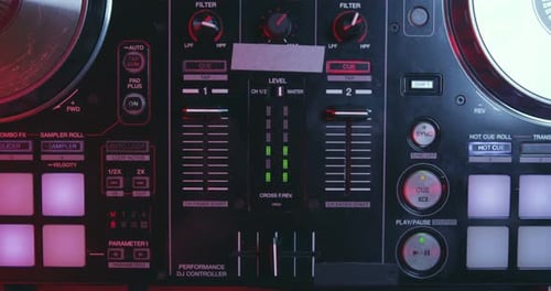 DJ Performance Controller Console in Nightclub Lighting