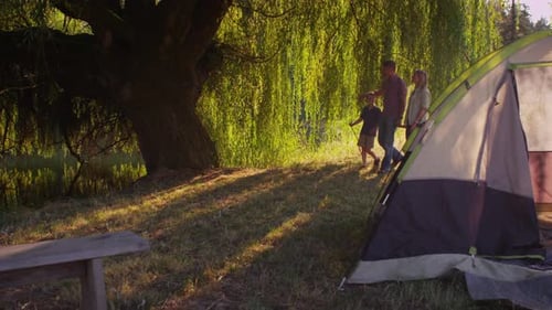 Family walking together at camp site