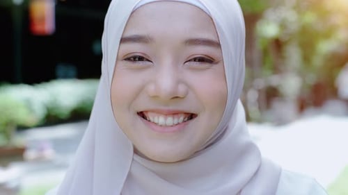 Smiling Woman Wearing Light Head Covering