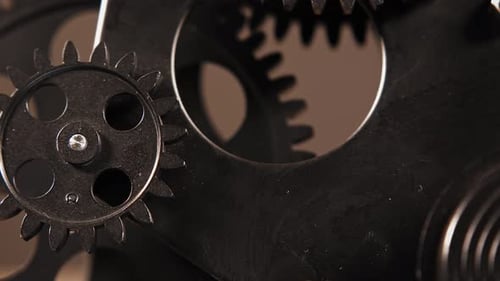 Close Up of Black Metal Gears Turning