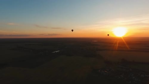 Hot Air Balloon in the Sky Over a Field.