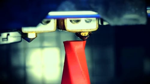 3D Printer Creating a Red Cone Object