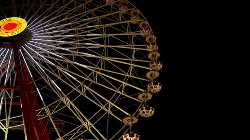 Ferris Wheel In Amusement Park At Night