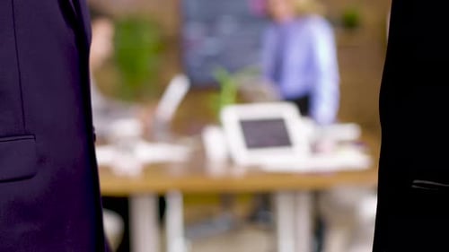 Close Up of Man and Woman Shaking Hands in the Office
