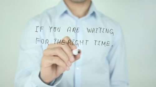 Man Writes Motivational Message on Clear Surface
