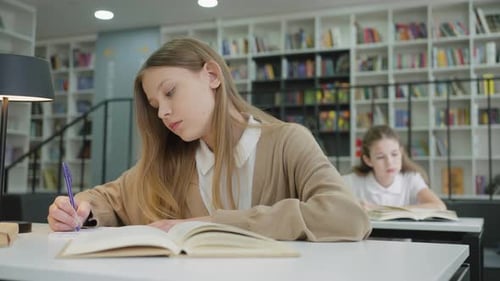 School Girl Writing in Class
