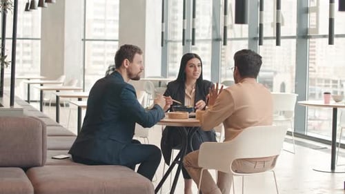 Multiethnic Colleagues Having Lunch at Food Court