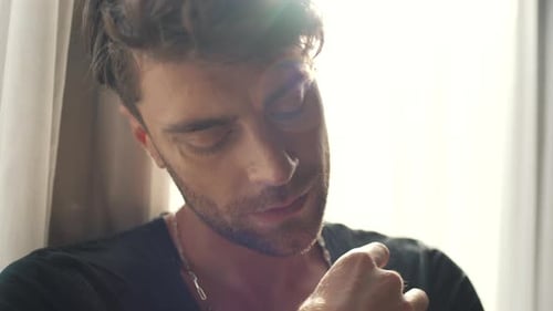 Man Shrewdly Looking at the Camera