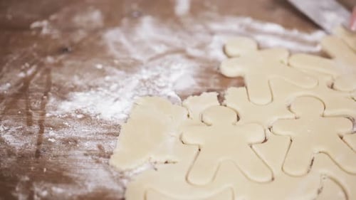 Hands Making Holiday Gingerbread Man Cookies