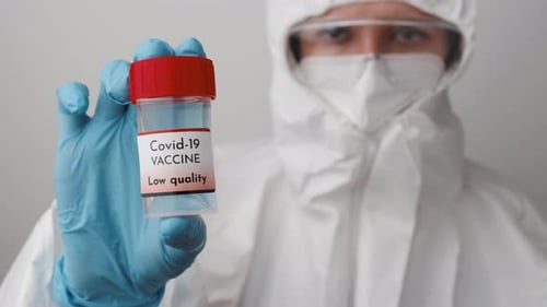 Researcher Holds Covid-19 Vaccine in Lab Setting